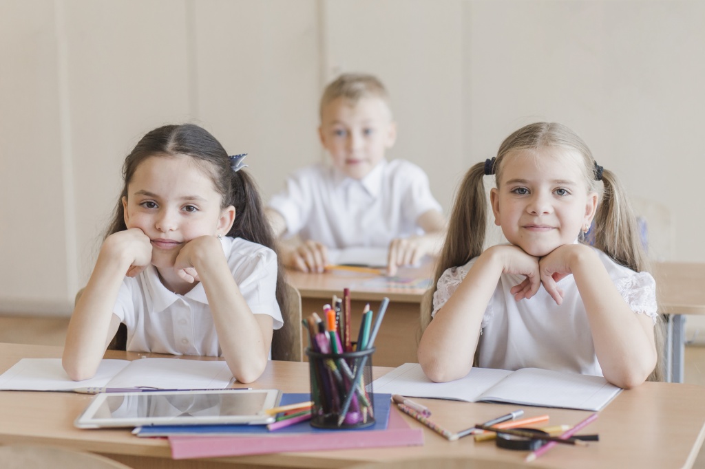 girls-sitting-desk-classroom.jpg